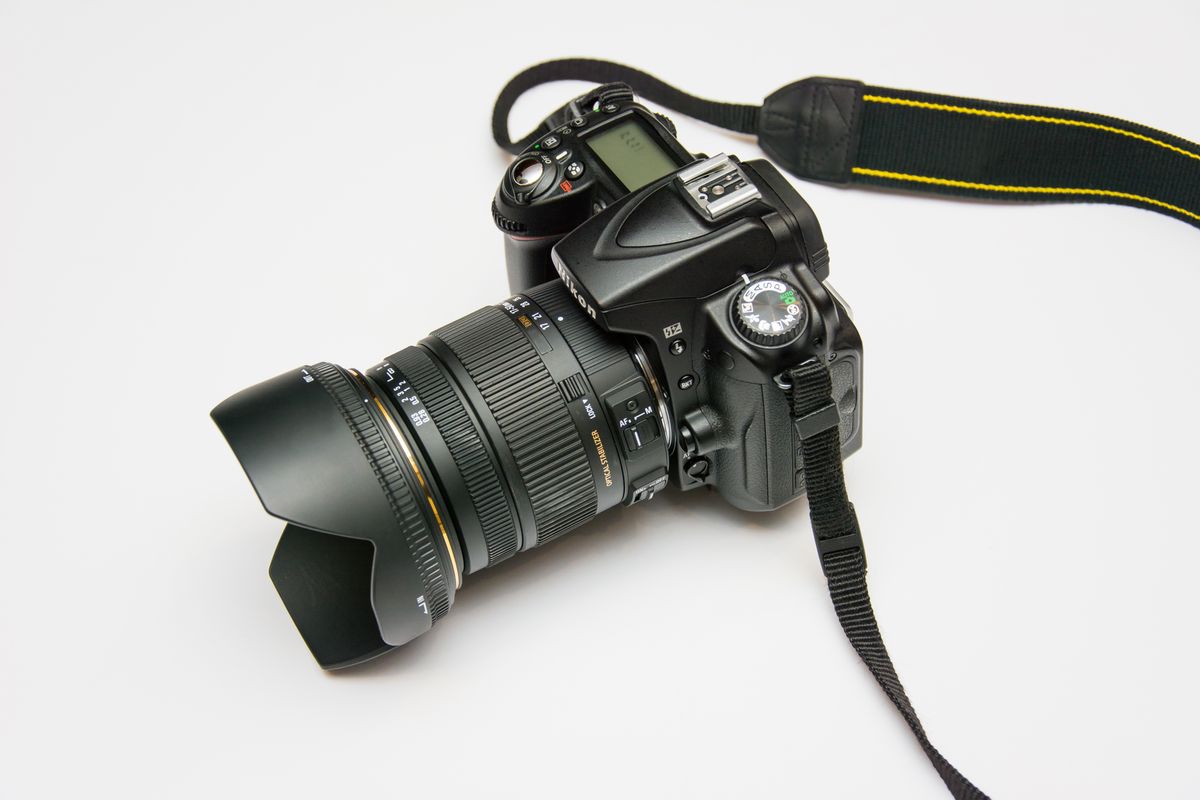 Camera body and lens caps on the picture desk table